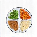 Icono de un plato con alimentos balanceados, simbolizando planes de alimentación.